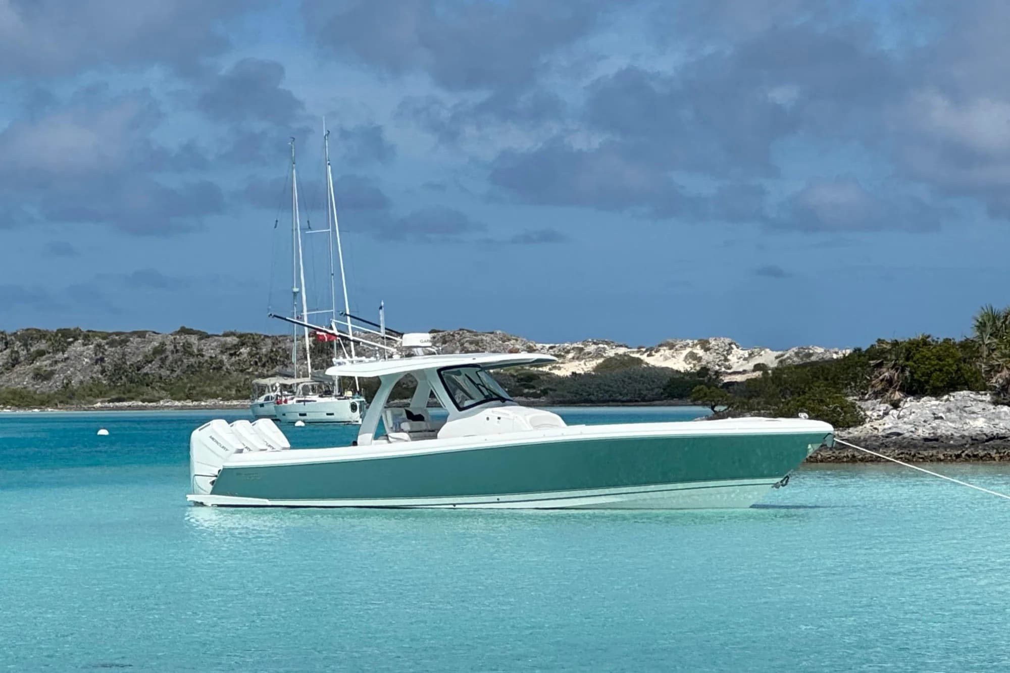 2025 Intrepid 375 Nomad SE at anchor in clear turquoise water