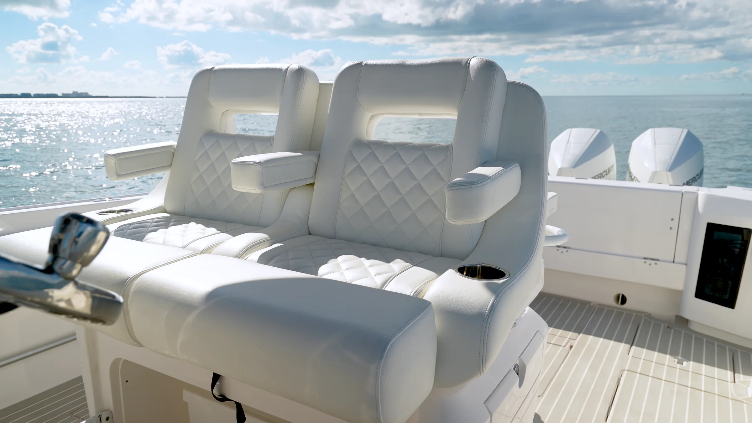Quilted white helm seating with the outboards beyond